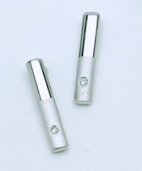 Silver earrings set with brilliant cut diamonds