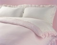 pastel-coloured frilled duvet cover