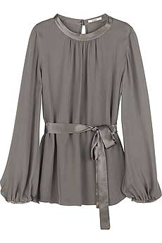 Truffle high neck silk blouse with satin trim and self-tie belt at waist.
