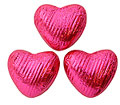 100 Fuschia pink, Foil wrapped, milk chocolate hearts