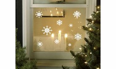 Purlees SNOWFLAKES Christmas window stickers by Purlees. Reusable. Static cling with a sparkle. Great for home or shop window. Largest flakes 13cm!