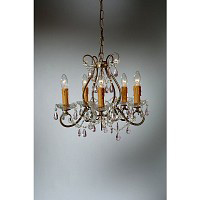 This attractive chandelier has an antique gold finish with floral design arms. The glass droplets ha