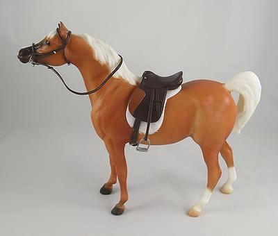 This is a 1/12th Classic Scale Genuine Breyer Palomino Half Arab Stallion. He measures 6`H x 2`W x