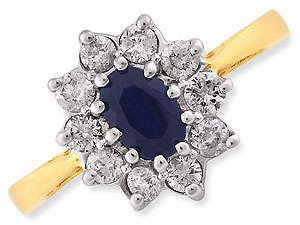A star-burst of diamonds (1/2ct total diamond weight) surrounds the oval blue sapphire at the centre