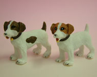 These charming Jack Russell Terrier in 1:12 scale and are made by heidi Ott. One is black and white