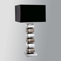 An elegant contemporary pebble table lamp in a polished and black chrome finish complete with matchi