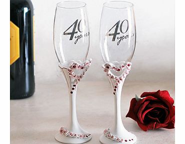 This gorgeous 40th Wedding Anniversary Pair of Heart Champagne Glasses would make the perfect gift for any special couple celebrating their ruby wedding anniversary.This set has two identical champagne flutes with the words 40 Years in silver writing