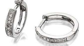 Perfect 1.2cm hinged white gold hoops, the front edge dotted with diamond accents, sitting closely on the ear with the huggie fitting.