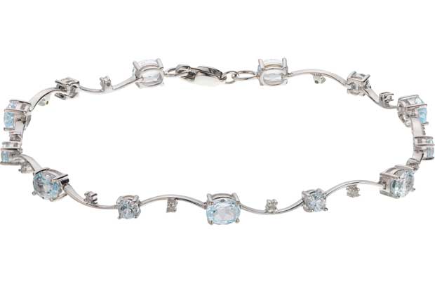 This stunning 9ct white gold bracelet designed with 10 delicately placed diamonds and blue topaz precious stones makes a gorgeous gift for someone special. The simple