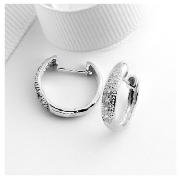 These 9 carat white gold hoops feature a row of diamonds, a subtle sophistication to any outfit.