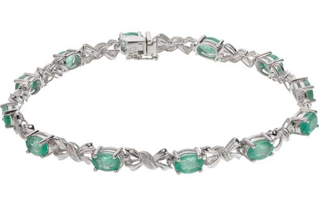 This stunning 9ct white gold bracelet designed with delicately placed bow shaped diamonds and precious emerald stones makes a gorgeous gift for someone special. The simple