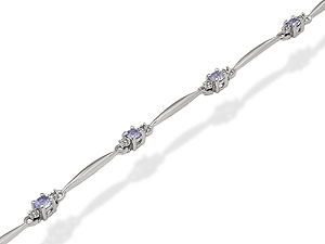 Eight pretty blue tanzanites and sixteen tiny diamonds create a lovely 9ct white gold bracelet.