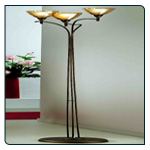 Soft brown Italian floor lamp with gold colour highlights with translucent amber glass housing a