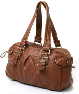Bowling shape shoulder bag featuring zip fastening closure, cotton lining and stud detail on the out
