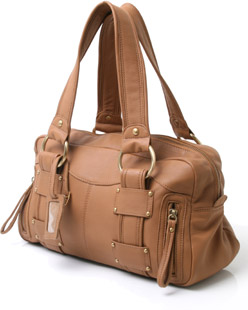 Leather bowling-bag shape handbag featuring travel tag and zipped sides. The Bdonna bag has brown co