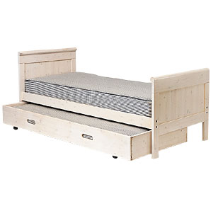 A whitewash bed and matching truckle set in solid