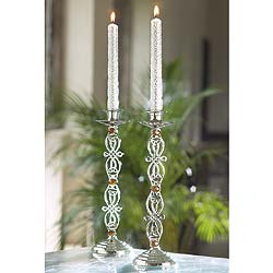 Scrolling interlaced motifs derived from Celtic designs decorate these graceful nickel-plated