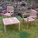A table and set of two stacking chairs made from luxurious teak.