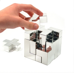 Like all great puzzles, the concept is simple. Take a cube and, with the use of a high tech saw, sli