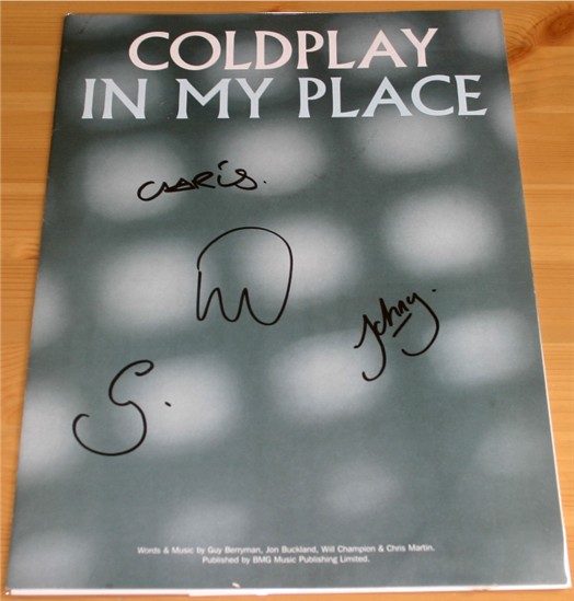 Coldplay sheet music booklet signed on the front cover by Chris  Guy  Will and Jon. The booklet is