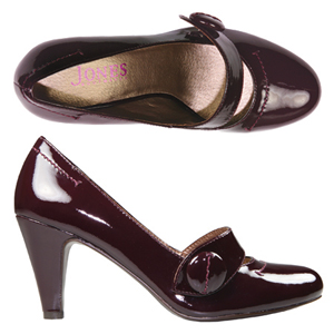 A fashionable Patent Court shoe from Jones Bootmaker. Features decorative Mary-Jane style strap with