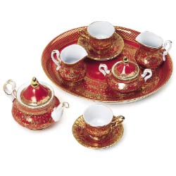 Treasure this perfect mini tea set, a true gem for