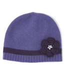 Cute and cosy pull-on hat with ribbed edging and featuring an appliqu‚ crochet flower decorated wi