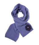 A luxuriously soft plain knit scarf decorated with an appliqu‚ crochet flower decorated with mini 