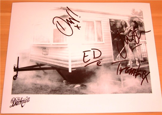 Black and white promotional photograph signed by Justin  Dan  Ed and Frankie from the massive