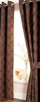 A printed half panama ring top pair of curtains with fashionable circular motifs design. Complete