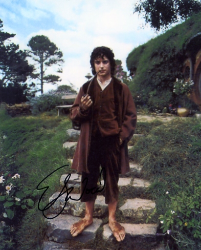 Signed by Elijah Wood in blue pen. Certificate of Authenticity no. 0100000475