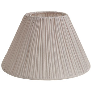 A pink pleated drum shade for a simple touch of elegance