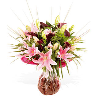 This extravagant selection of scented Pink Oriental Lilies and deep Purple Calla Lilies give this sp