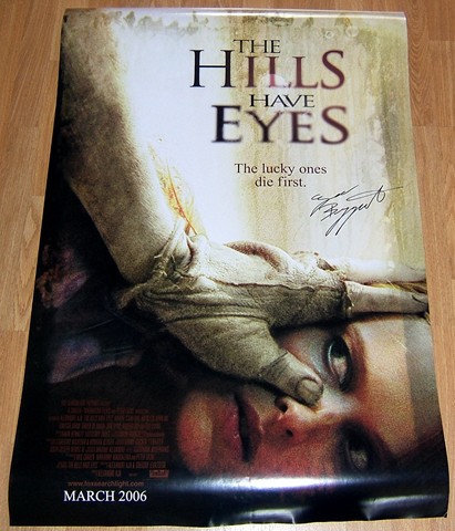 A full sized movie poster from the 2006 movie `The Hills Have Eyes` signed by Ezra Buzzington