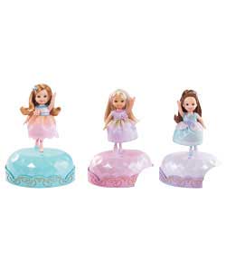 Each is dresses in an adorable dress and comes with a gem-inspired base that charges the doll when