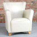 The Fidel club leather armchair features a combination of curved and straight lines to give this