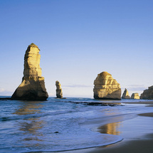Experience the dramatic sea cliffs, roaring surf, white sand beaches and ancient rainforest as you t