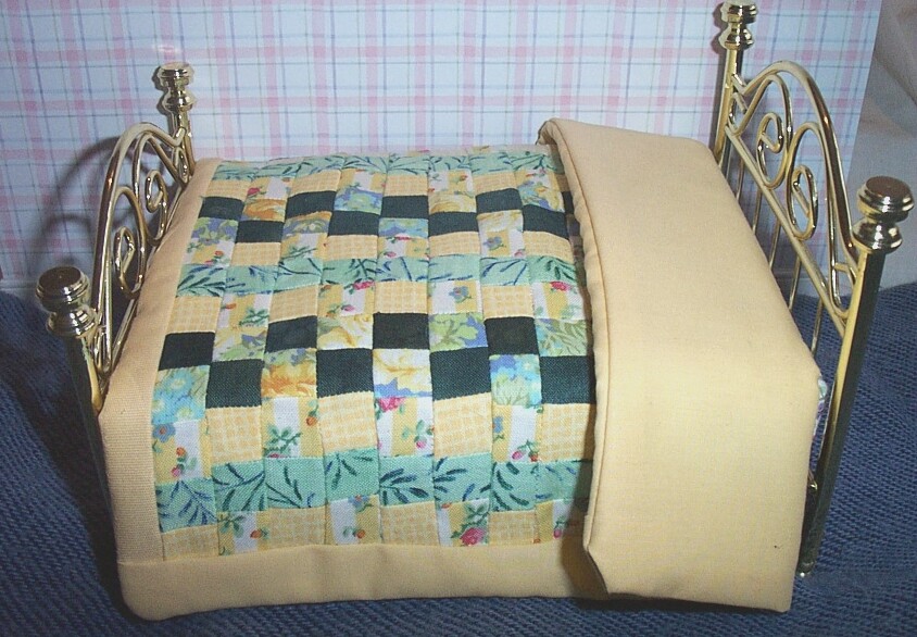 This is a genuine handmade patchwork quilt made especially for The Dolls House Store by Sally