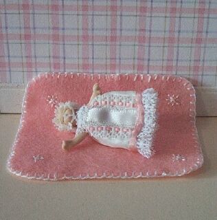 This delightful little 1:12 scale pink baby blanket is handmade exclusively for us by Sally