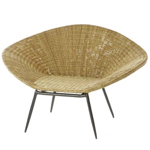 Relax in colonial style on this natural wicker sco