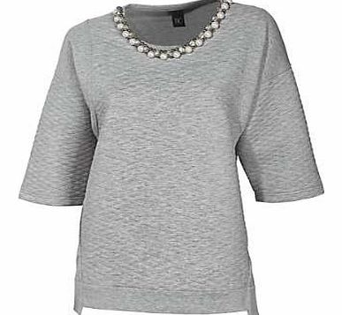 Stylish, loose fit top in textured design with pretty faux pearl and gemstone decoration at the neckline. Heine Top Features: Plain insert on the arms and hem Washable Cream/Rose/Black: 95% Polyester, 5% Elastane (Plain section: 95% Cotton, 5% Elasta