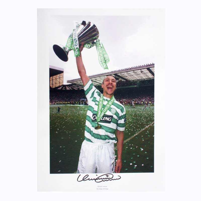 This photograph shows Celtic legend Henrik Larsson celebrating with the Scottish Premiership trophy 