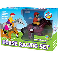 The set contains three lengths of track with barriers  sign and a clockwork horse and rider. Put the
