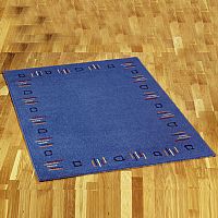 A contemporary rug with border detail in soft tone
