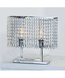 This chic table lamp is ideal for re-creating a retro look. With a chrome finish metal base and spar