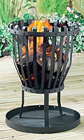 Outdoor heater/barbecue. Can be used to burn seasonal logs or used as a BBQ with charcoal. Complete
