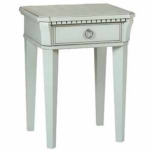 A distinctive bedside table with ornate detailing