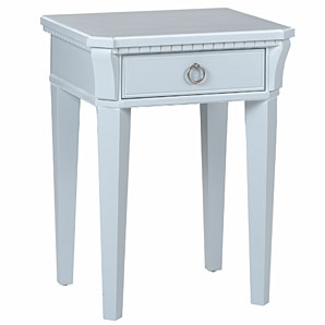 A distinctive bedside table with ornate detailing