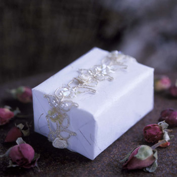 2 x 80 g  two aromatherapy soaps exquisitely wrapped in hand made paper with beads and sequins
