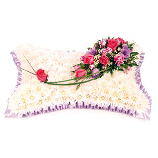A pretty massed pillow with a double spray in pinks and lilacs.